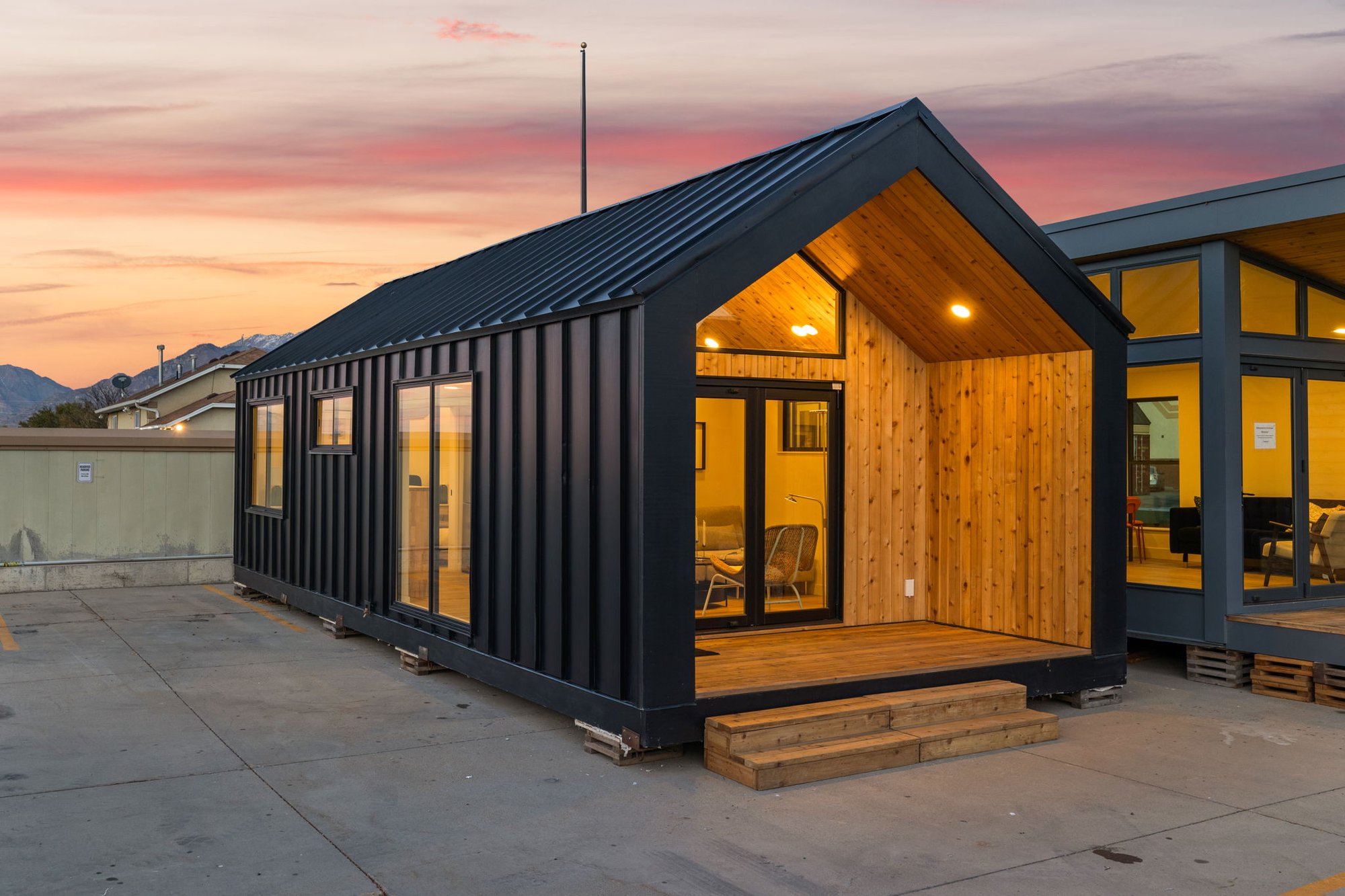 Modular cabin at sunset with mountains